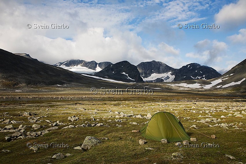 Camp inTrollsteinkvelven valley loooking towards Svartholshøe, Trollstein-rundhøe, Grotbreahesten and Trollsteineggje (right to left). Jotunheimen National Park. Norway.