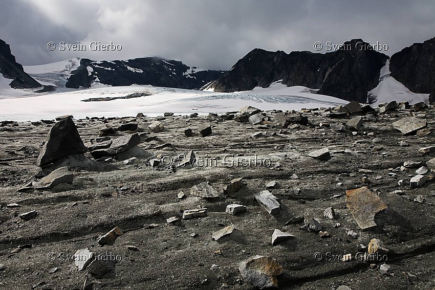 In Trollsteinkvelven valley loooking towards Glittertinden, Norways second highest mountain (right to left) and Austre Glittertindoksle, Grotbrean glacier below. Jotunheimen National Park. Norway. Jotunheimen National Park. Norway.