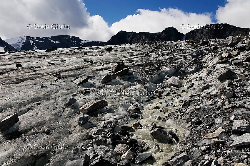 On Grotbrean glacier loooking towards Trollsteineggje (right) and Glittertinden, Norways second highest mountain. Jotunheimen National Park. Norway.