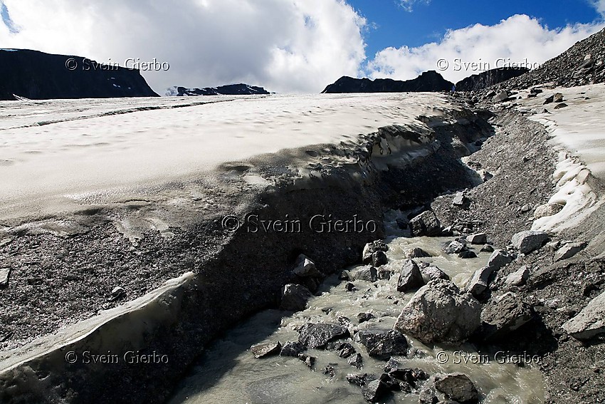 On Grotbrean glacier loooking towards Trollsteineggje. Jotunheimen National Park. Norway.