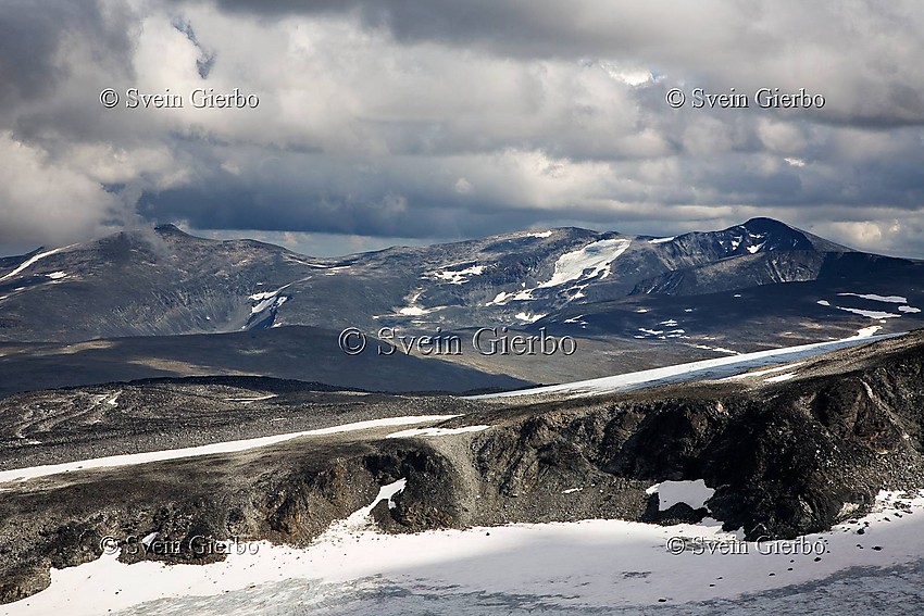 Grotbrean glacier with Nautgardstindene in the distance. Jotunheimen National Park. Norway.