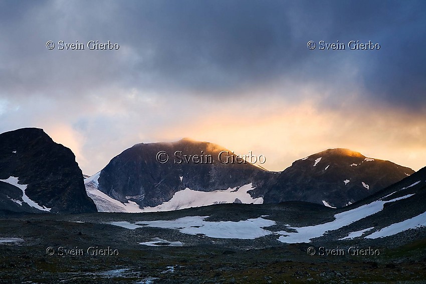 In Trollsteinkvelven valley. Grotbreahesten (left) and Grotbrean glacier. Trollsteintjønne lake below. Jotunheimen National Park. Norway.