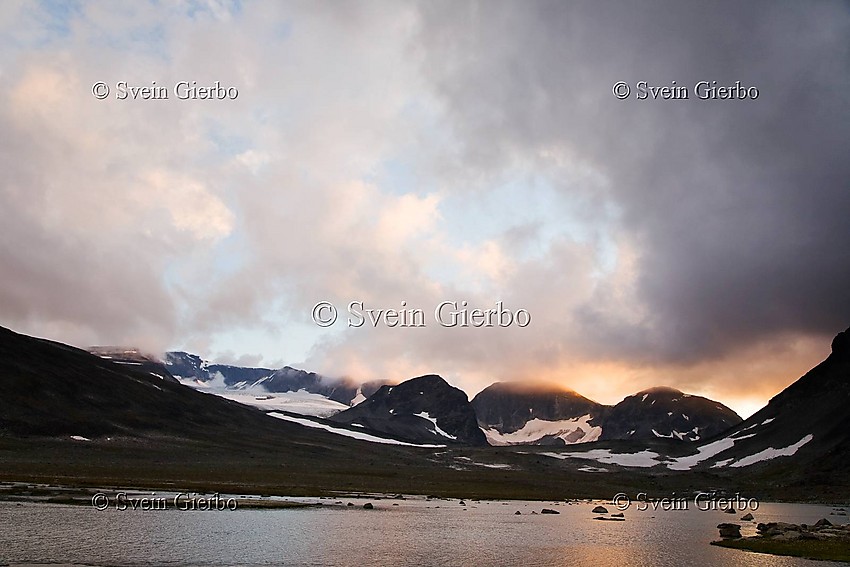 In Trollsteinkvelven valley. Loooking towards Svartholshøe, Trollstein-Rundhøe, Grotbreahesten, Trollsteineggje and Glittertind, Norways second highest mountain (right to left) and Grotbrean glacier. Jotunheimen National Park. Norway.