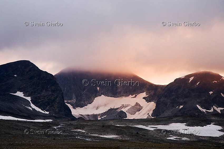 In Trollsteinkvelven valley. Grotbreahesten (left) and Grotbrean glacier. Trollsteintjønne lake below. Jotunheimen National Park. Norway.