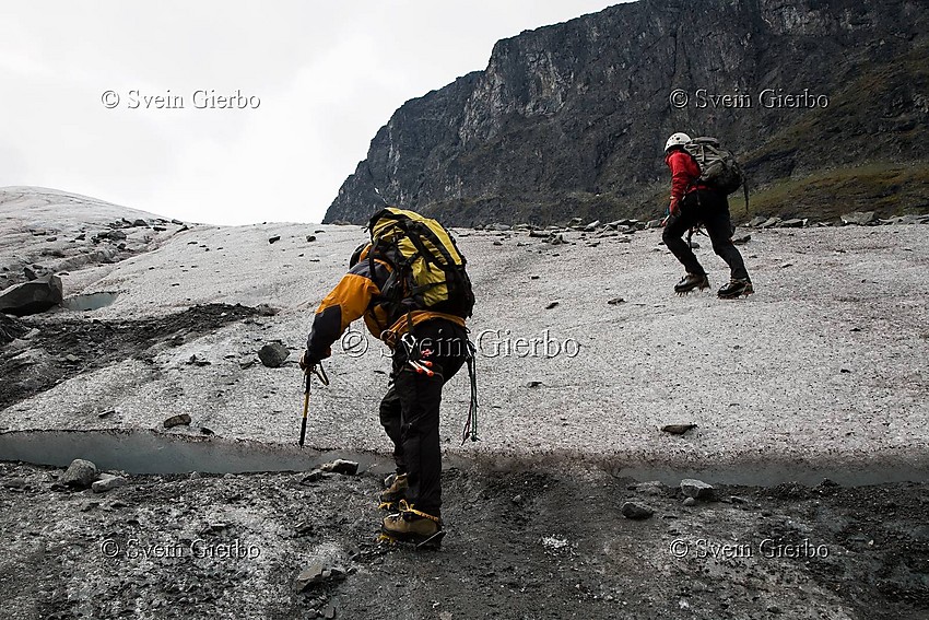 Hikers on Storjuvbrean glacier. Jotunheimen National Park. Norway.