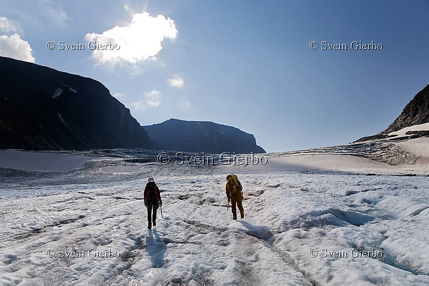 Hikers on Storjuvbrean glacier. Jotunheimen National Park. Norway.