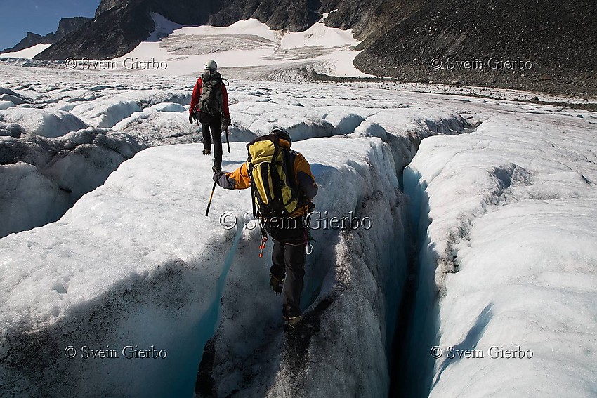 Hikers on Storjuvbrean glacier. Jotunheimen National Park. Norway.